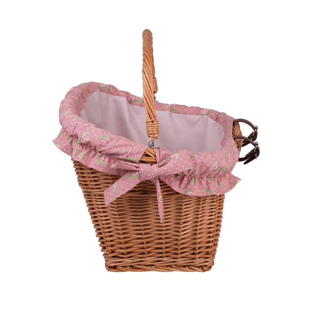 7. Side view of handmade wicker bike basket with pink floral fabric liner and leather straps, highlighting easy carry-off use