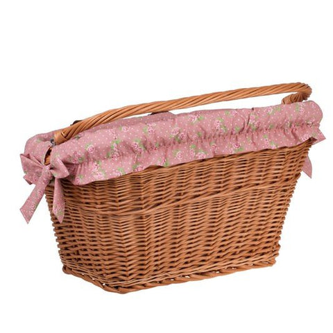 2. Side view of handmade wicker bike basket with pink floral fabric liner and leather straps, highlighting rustic design