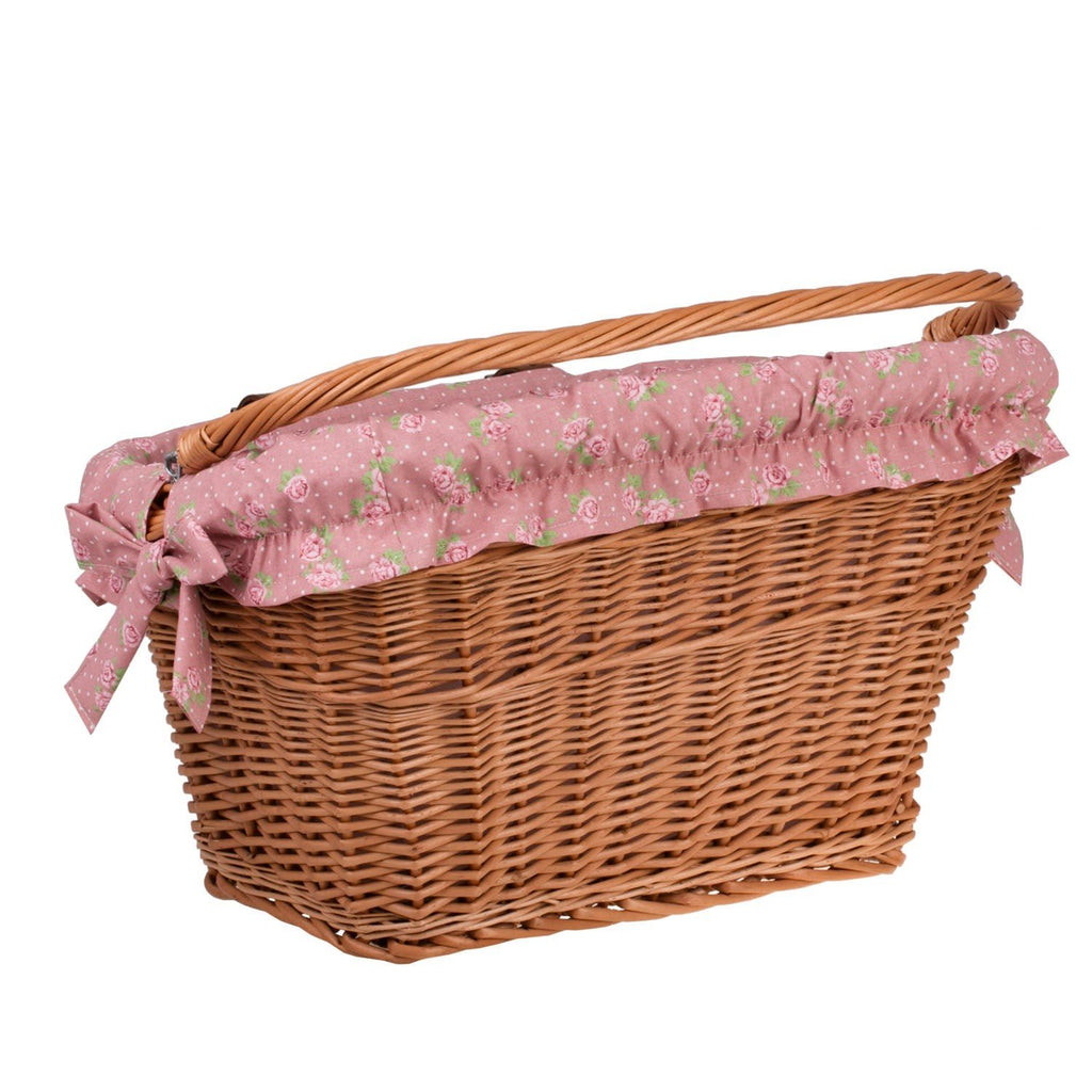 8. Vertical view of handmade wicker bike basket with pink floral fabric liner and handle, showcasing rustic charm and functionality