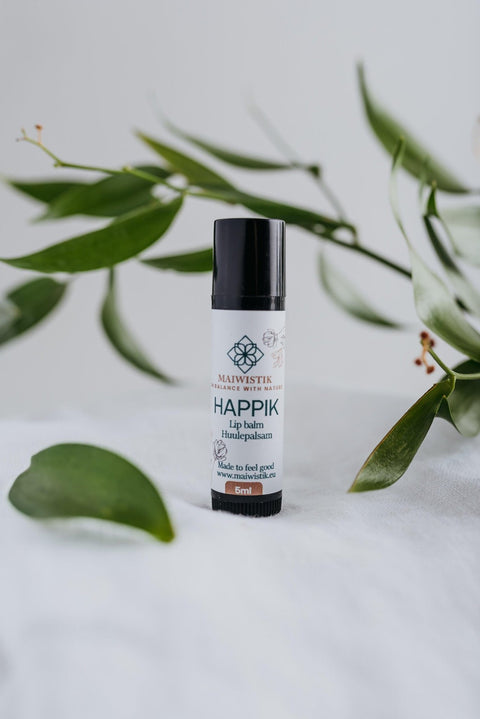 2. MaiWistik Happik Lip Balm in studio setting with herbal ingredients, 5ml tube