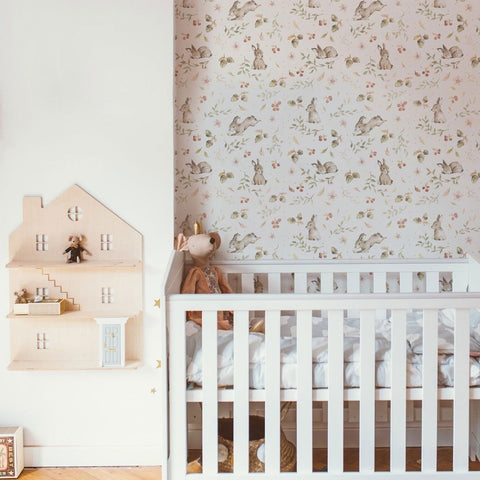 1. Nursery room with white crib and Dekornik Happy Rabbits wallpaper featuring playful rabbits and floral patterns on the wall