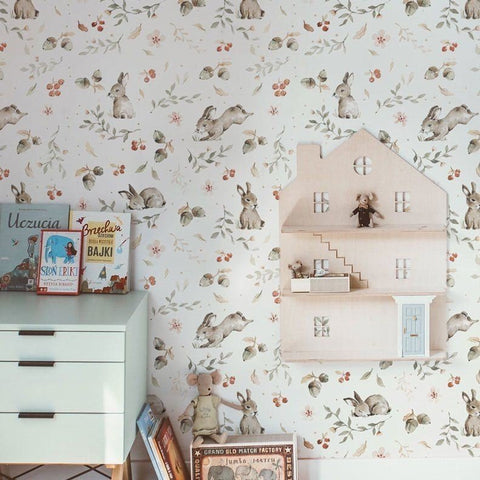 2. Children's room with Dekornik Happy Rabbits wallpaper, featuring rabbits and floral designs, alongside a wooden dollhouse shelf