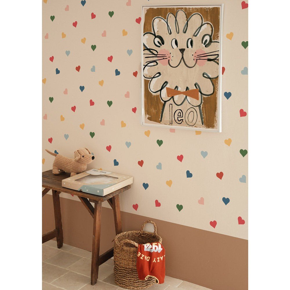 5. Playroom corner with Dekornik heart-patterned wallpaper, featuring a wooden bench, toys, and a lion illustration