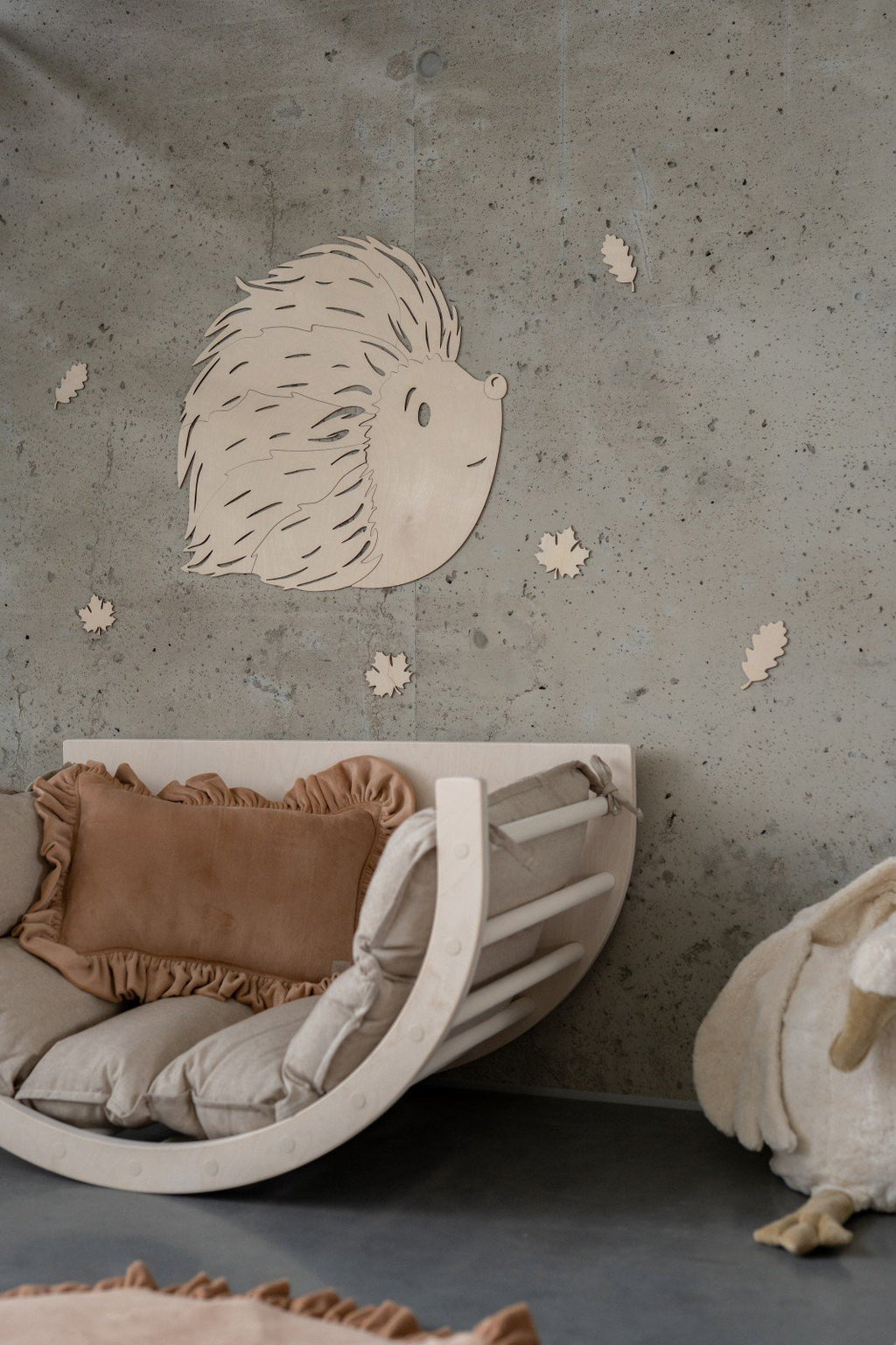 1. Birch plywood hedgehog wall decoration in children's room with rustic decor and cozy seating