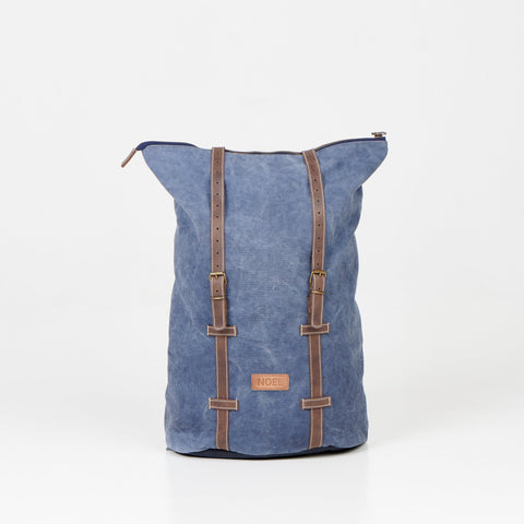 2. Back view of Noel ZIP Backpack in blue, highlighting leather straps and canvas material