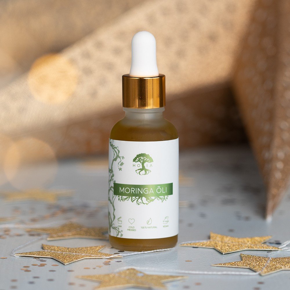 1. HOIA homespa Organic Moringa Oil 30ml bottle with dropper, shown in a decorative setting, highlighting its natural and eco-friendly packaging
