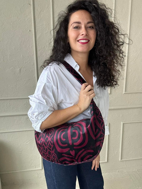 4. Woman posing with Garbanota burgundy pattern hobo bag, showing off stylish and functional accessory