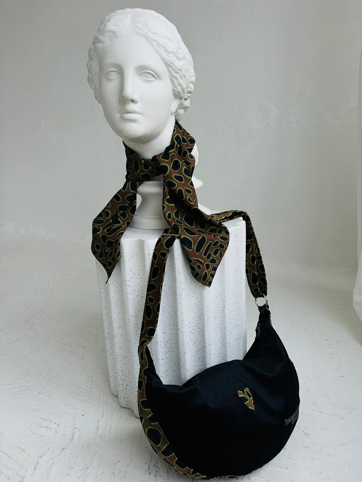 4. Garbanota Hobo Bag - Leopard Heart with matching scarf on mannequin, emphasizing unique craftsmanship