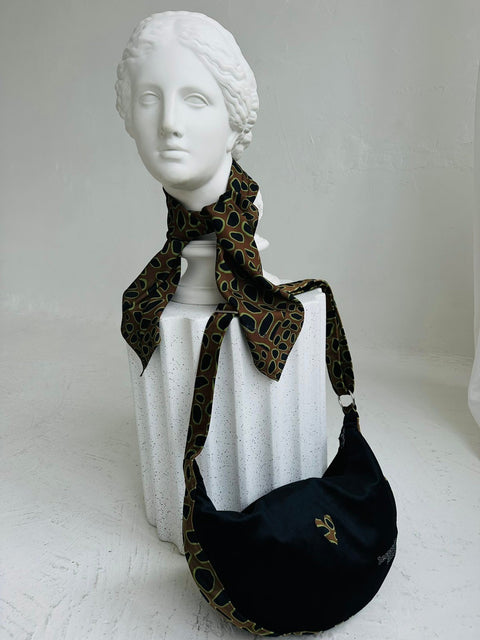 4. Garbanota Hobo Bag - Leopard Heart with matching scarf on mannequin, emphasizing unique craftsmanship