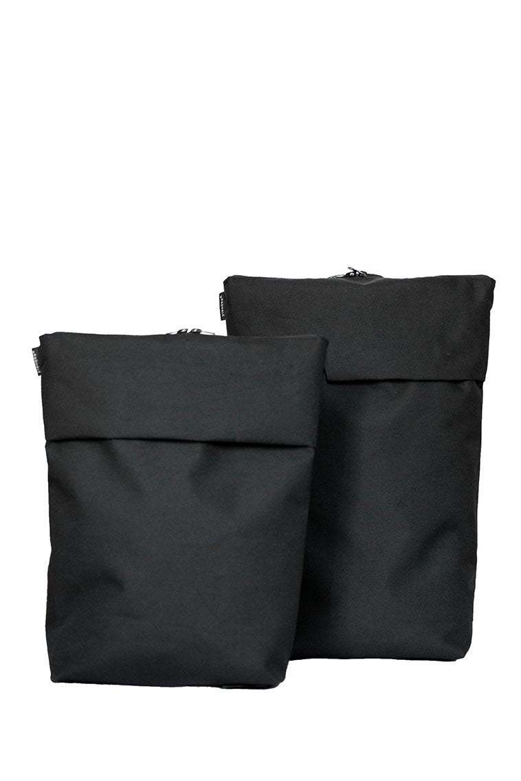 14. Studio shot of two Nordhale HØLAR Weatherproof Backpacks, front view, showcasing minimalist style