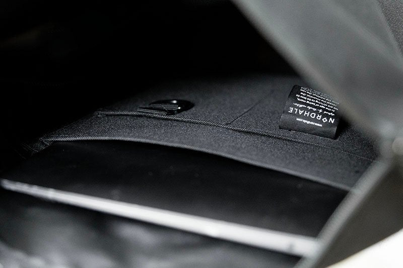 8. Interior view of Nordhale HØLAR Weatherproof Backpack showing laptop sleeve and spacious compartment