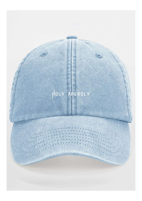 2. Studio shot of pastel blue Holy Aperoly cap by Black Giraffe Brand with white logo on front