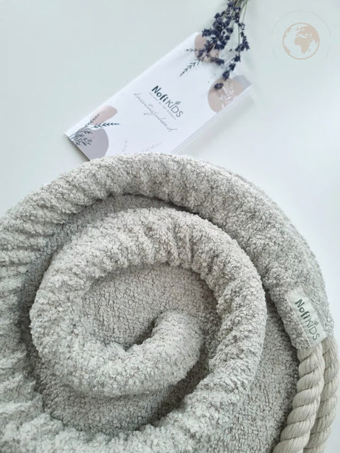4. Detail of Nofi KIDS bouclé pearl white swing fabric and rope with brand tag