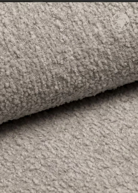 2. Close-up of textured bouclé fabric in pearl white for children's swing