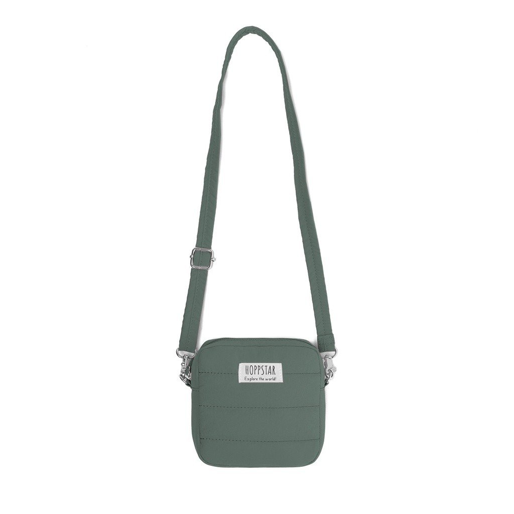 15. Green Hoppstar camera bag with long strap, displayed on white background
