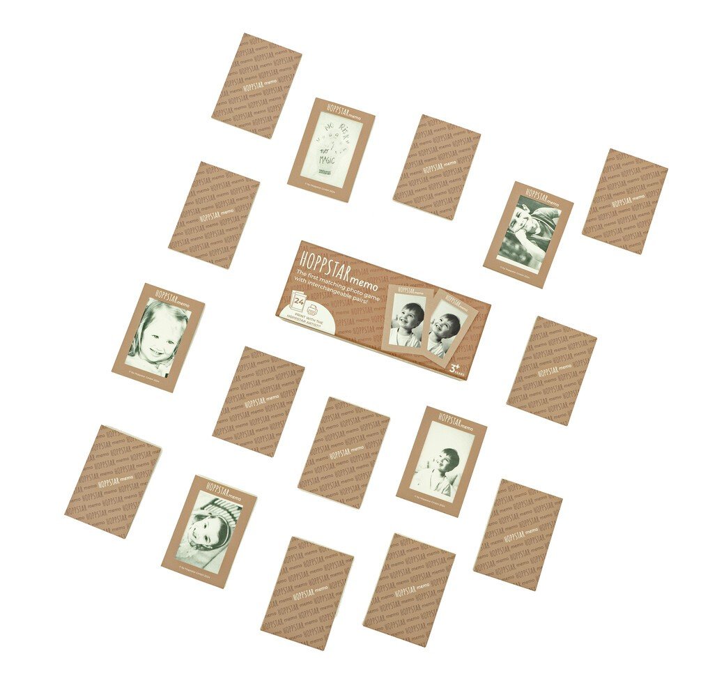 4. Flat lay of Hoppstar Memory Game envelopes and photo cards arranged on a white surface