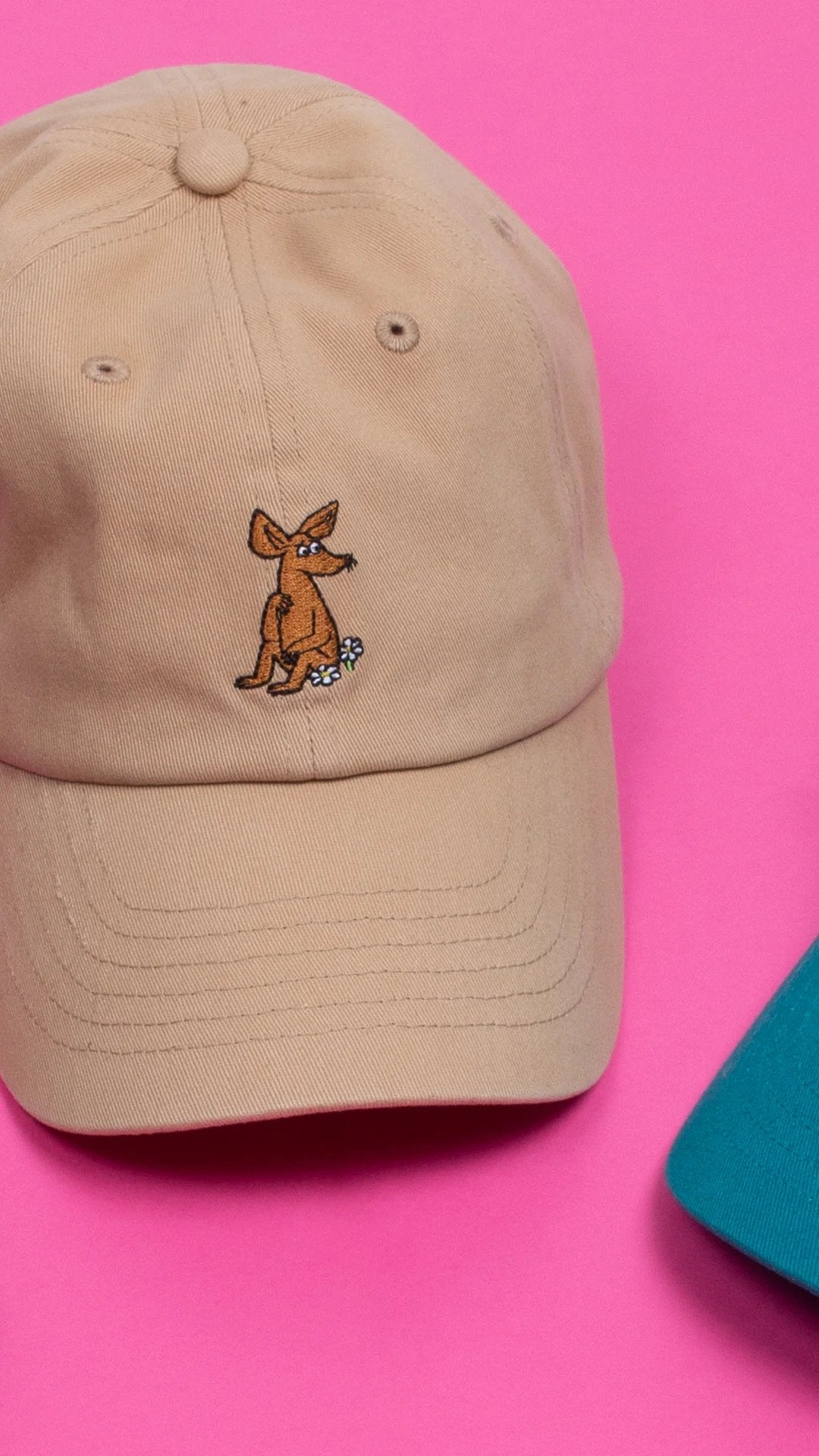 1. Sniff Adult Cap in sand color by Moomin, displayed on a pink background