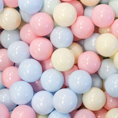 3. Close-up of IGLU pastel ball pit balls in soft pink, blue, and yellow colors, highlighting smooth texture and gentle tones