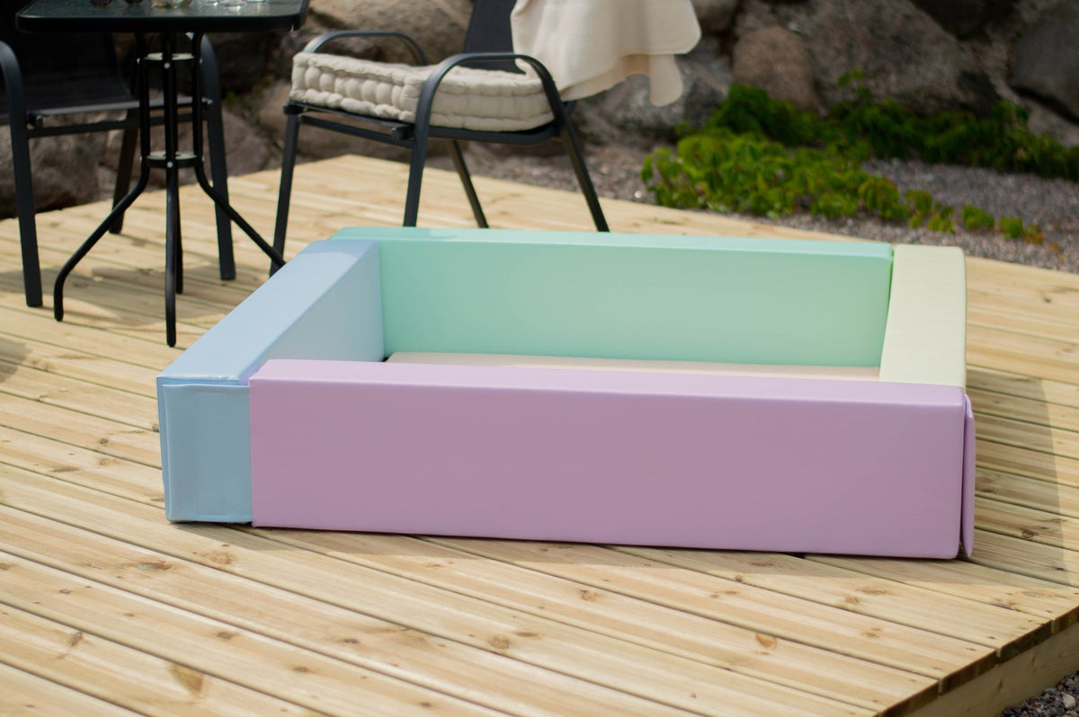 4. IGLU light pastel foam ball pit on wooden deck showing pastel color design