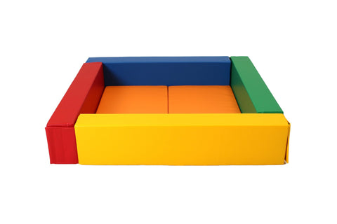 3. Studio shot of empty multicolor IGLU soft play ball pit with red, blue, green, and yellow sides