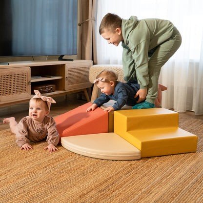 1. Three children playing on colorful IGLU Corner Climber foam blocks in a living room setting
