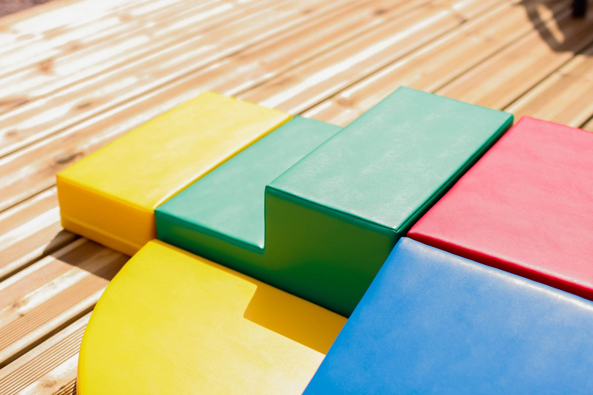 8. Close-up of multi-color foam block set on a wooden deck highlighting texture and color