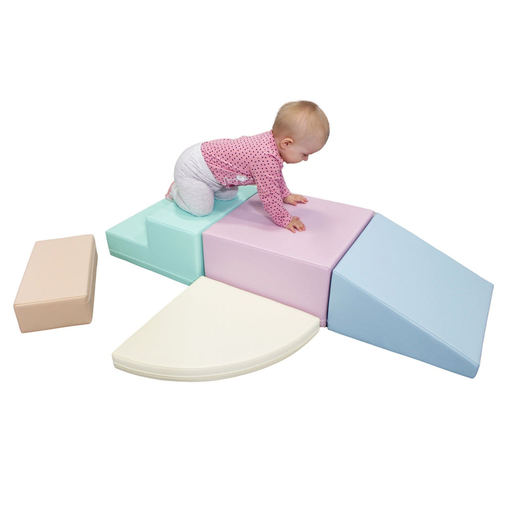 9. Baby playing on IGLU pastel foam blocks, promoting sensory stimulation and creativity