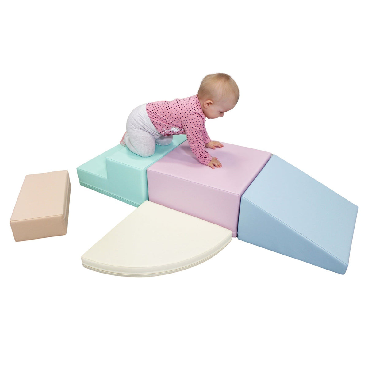 9. Baby playing on IGLU pastel foam blocks, promoting sensory stimulation and creativity