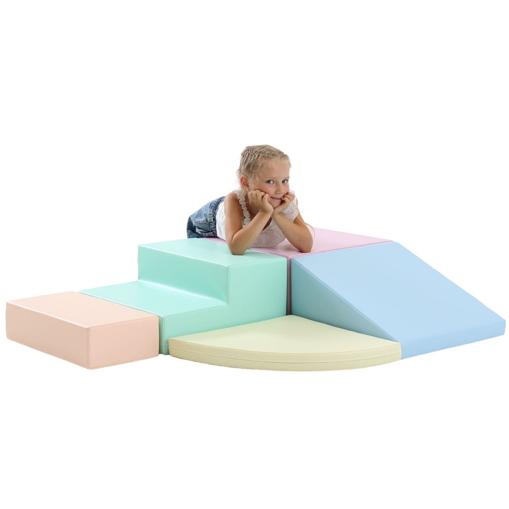 13. Child lying on IGLU pastel foam blocks, promoting relaxation and sensory stimulation