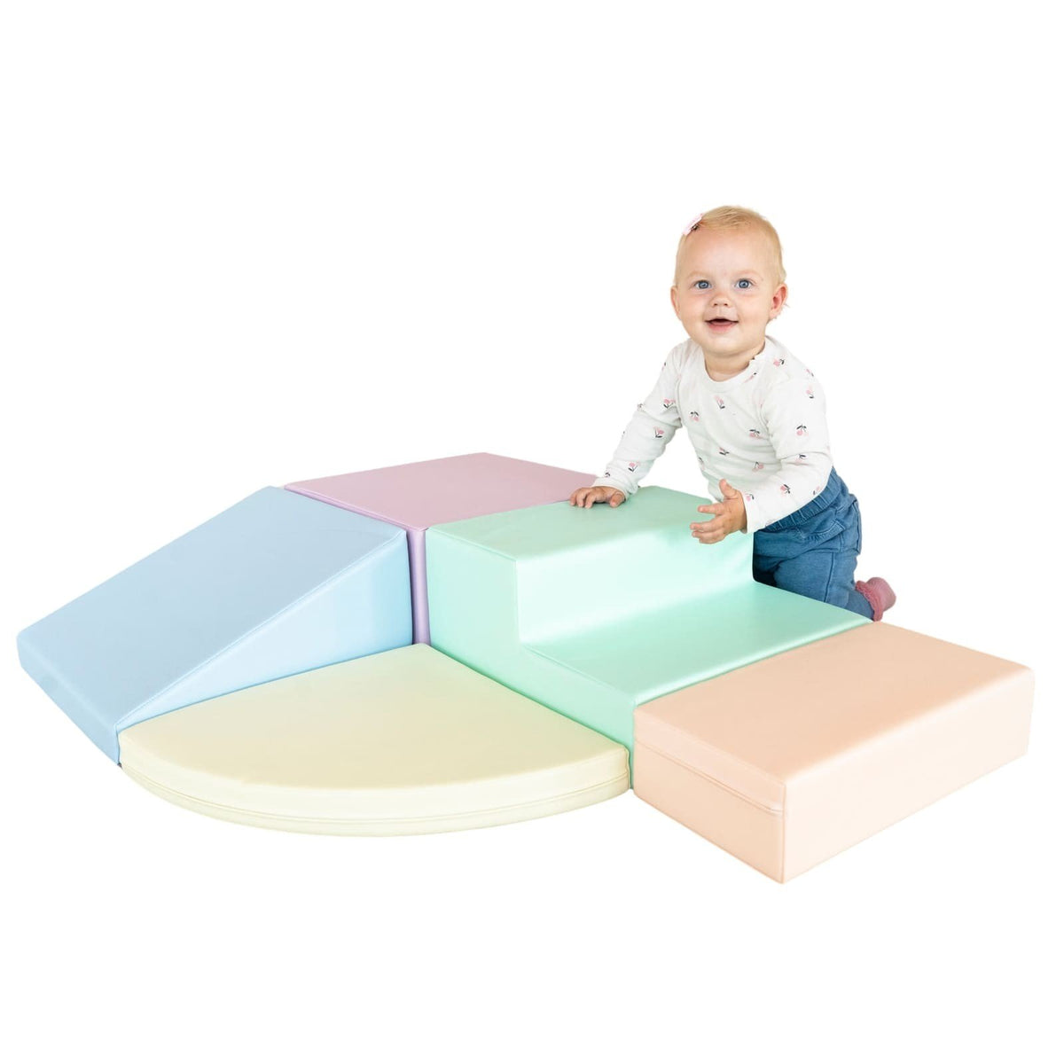 11. Baby sitting on IGLU pastel foam blocks, encouraging exploration and motor skill development