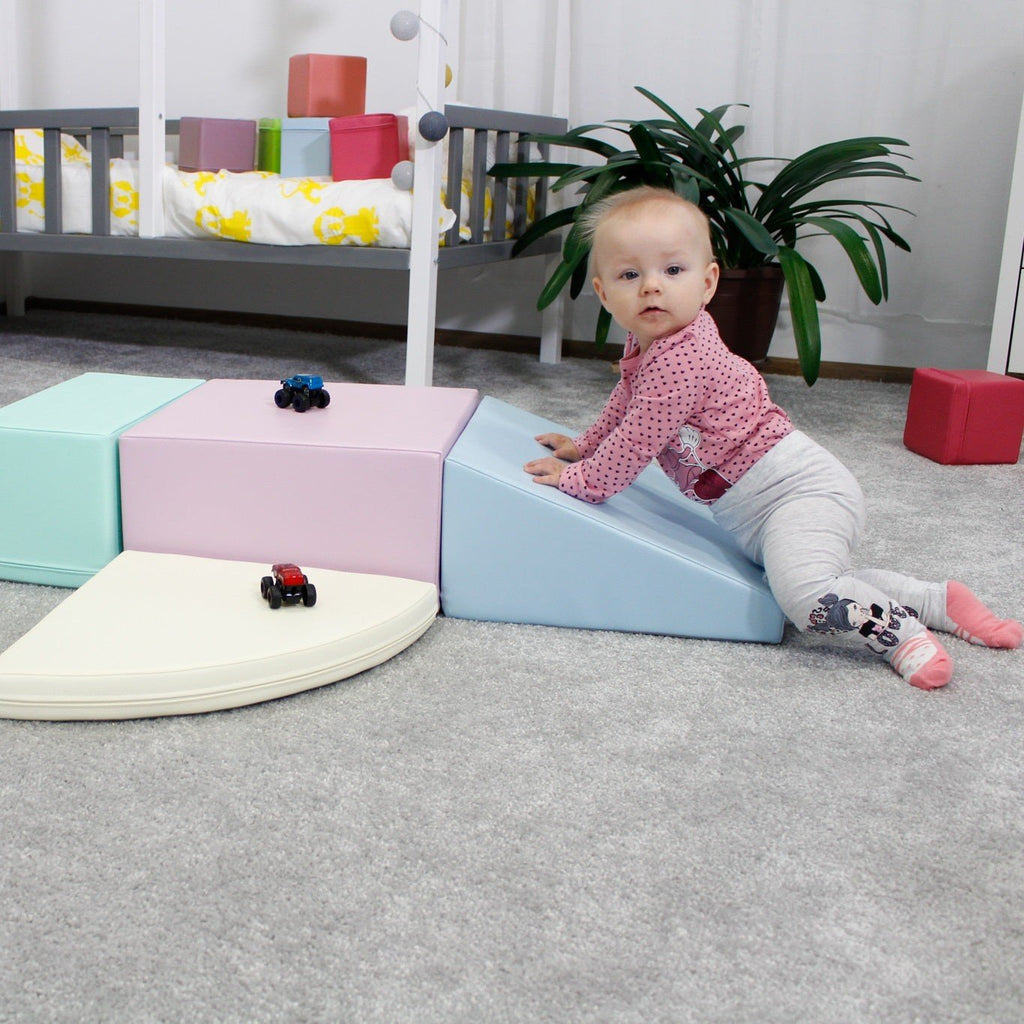 12. Toddler playing on IGLU pastel foam blocks in a nursery, boosting creativity and social skills