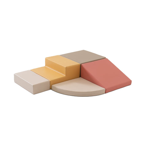 1. Pastel pink and beige foam block set arranged in a corner climber configuration on a white background