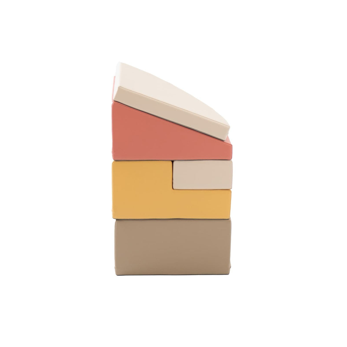 7. Side view of stacked pastel pink and beige foam blocks showing different shapes