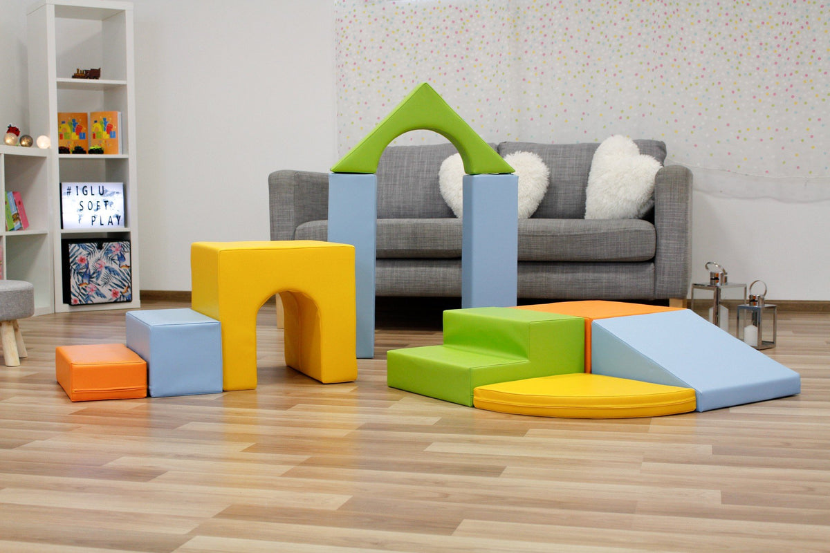 9. IGLU foam block set in light multicolor arranged in a living room with wooden floor