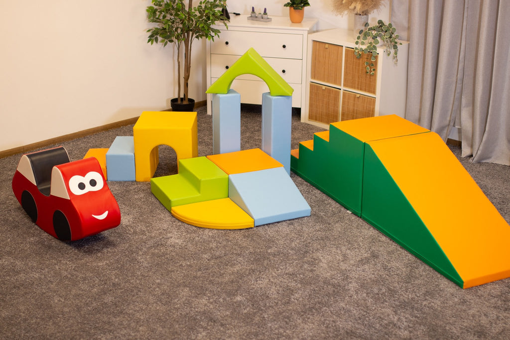 3. IGLU foam block set in light multicolor with additional red car-shaped block in a playroom