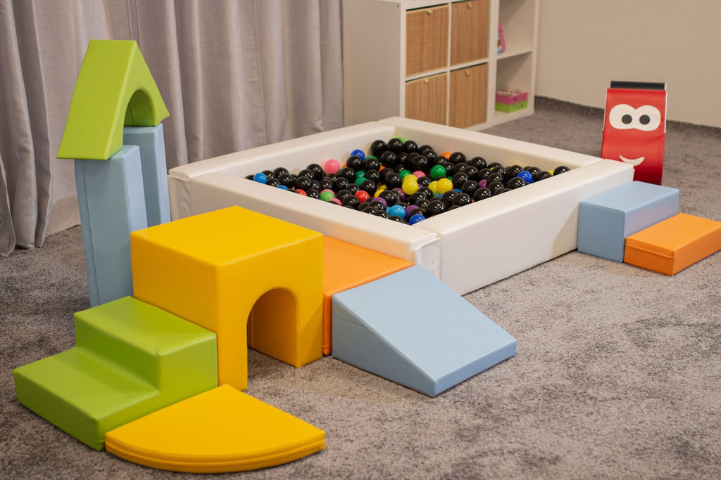 4. IGLU foam blocks in light multicolor arranged around a ball pit in a playroom