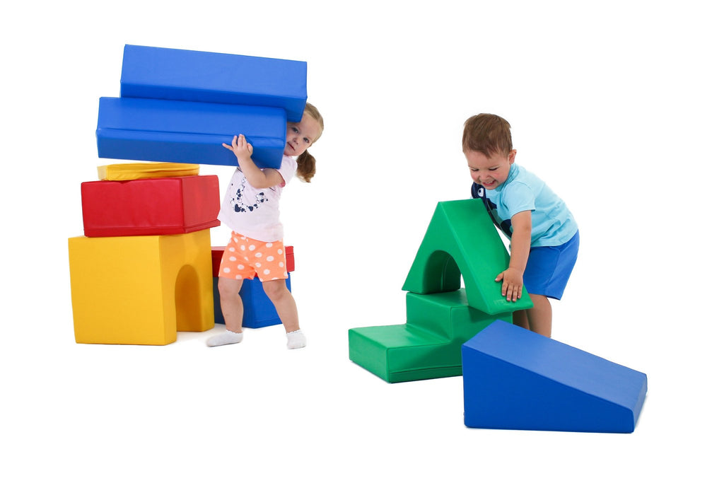 12. Two children lifting and arranging multicolor foam blocks