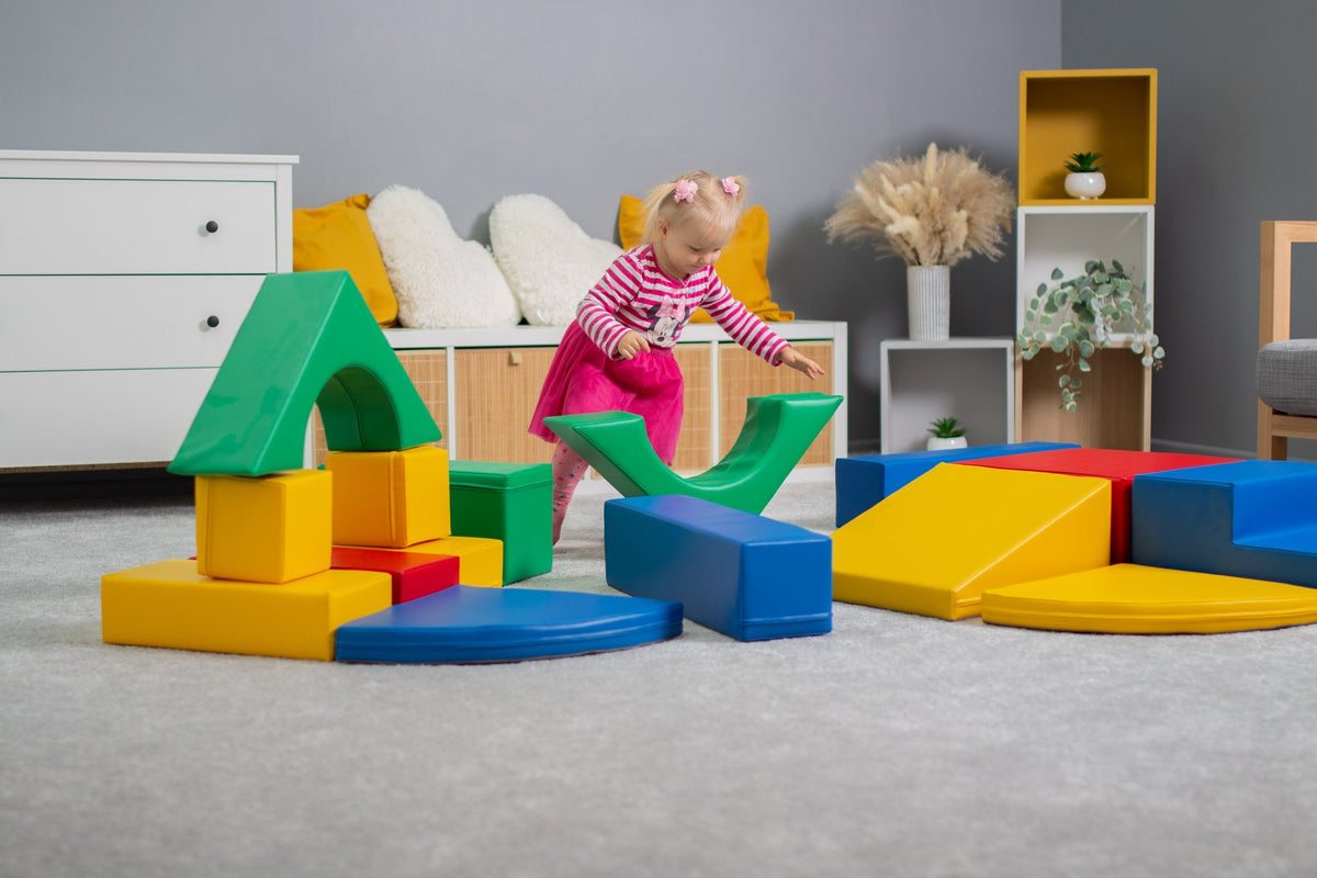 10. Girl playing with multicolor foam blocks on a carpeted floor in a playroom