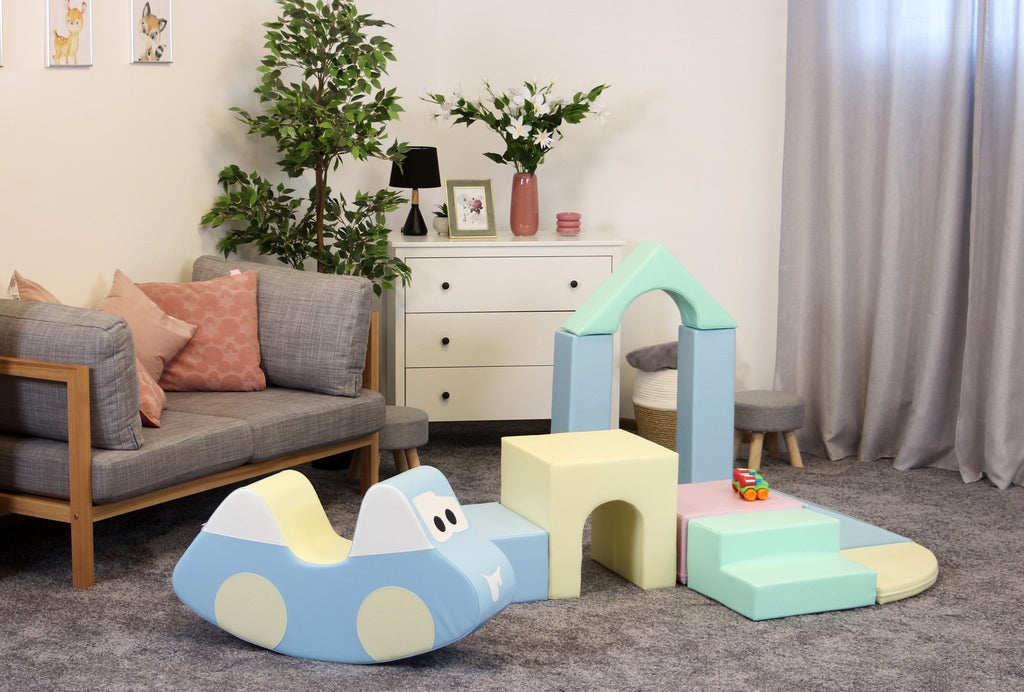 1. Indoor playroom with pastel foam blocks and a blue foam car, enhancing creative play