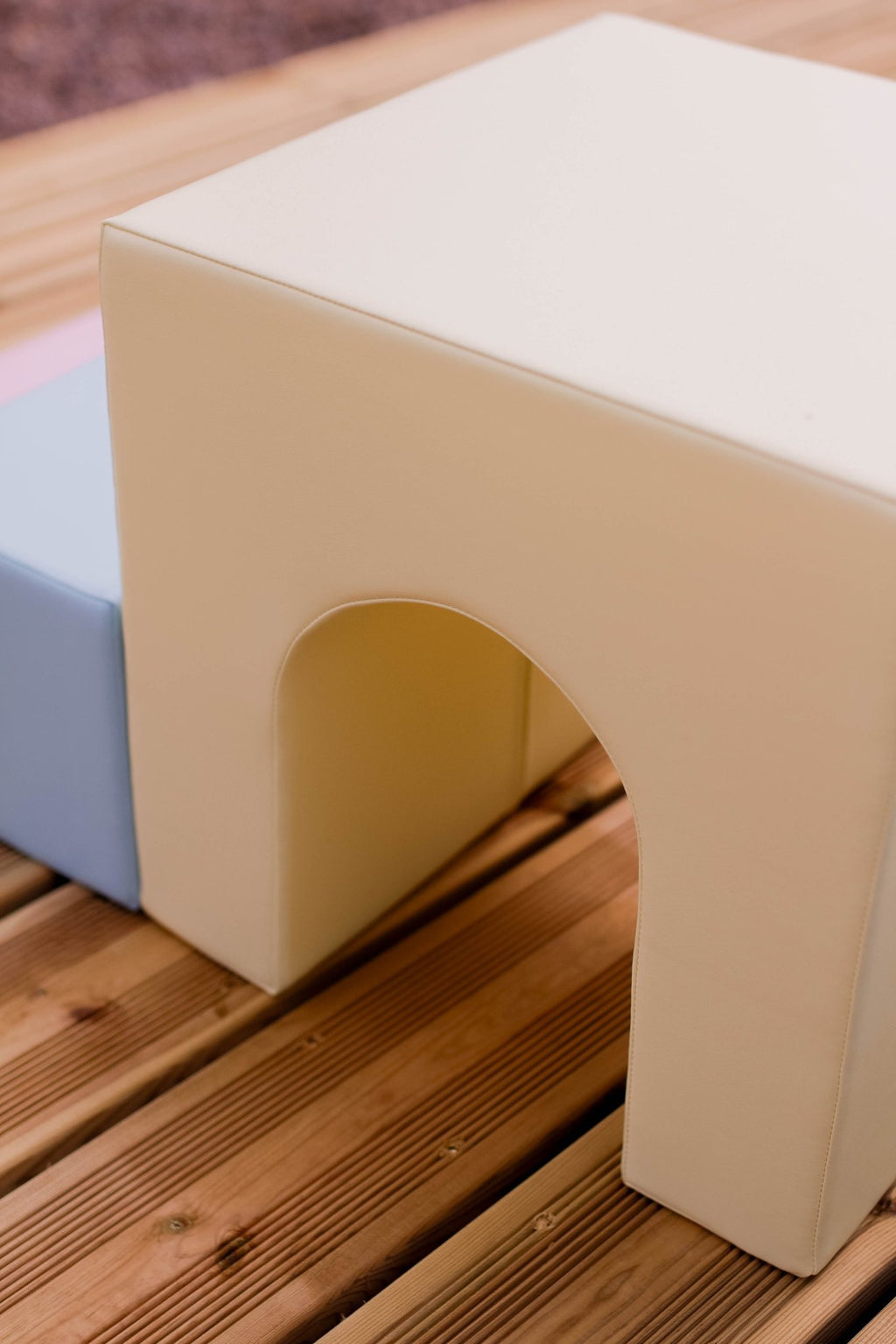 3. Close-up of yellow and blue foam blocks with archway detail on wooden surface