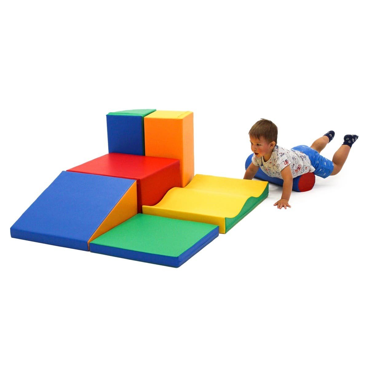 1. Child lying on multicolor foam blocks in a playroom setting