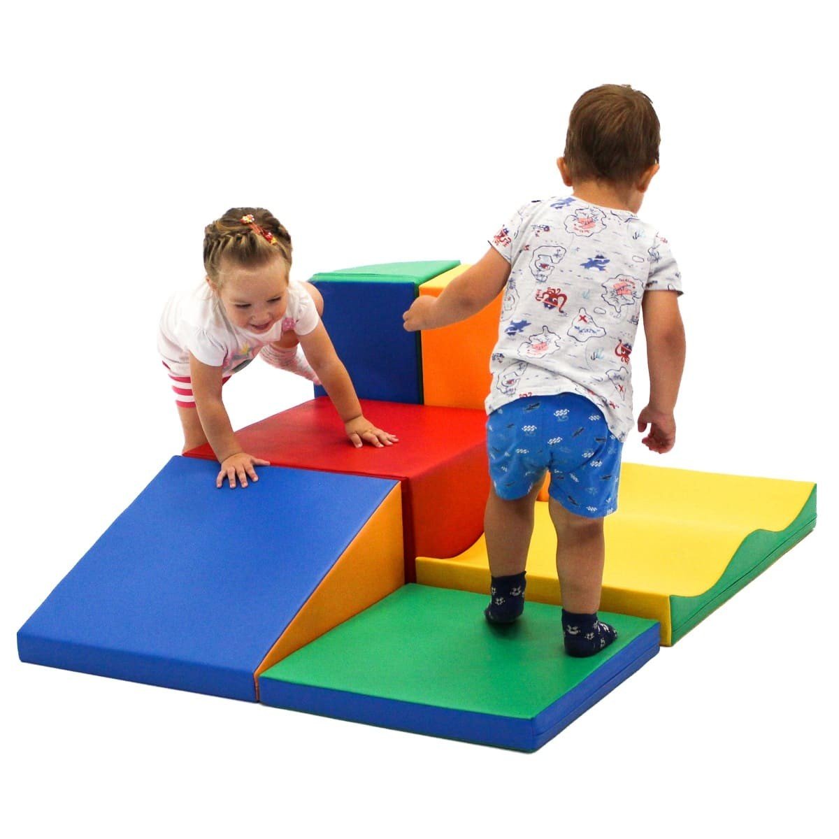1. Two children playing on multicolor foam blocks in a playroom
