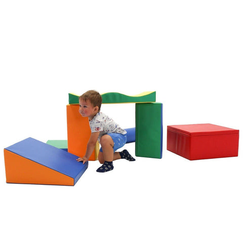 1. Child playing with multicolor foam blocks in a playroom setting