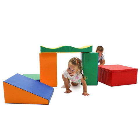 1. Two children crawling through multicolor foam blocks in a playroom