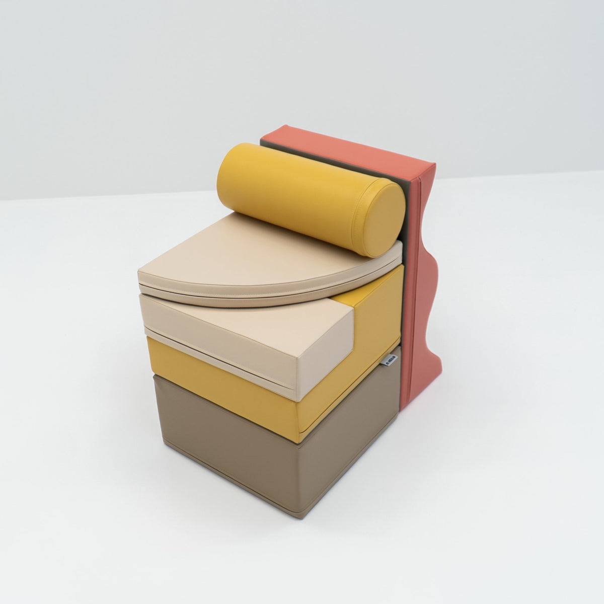 2. Stacked pastel pink and yellow foam blocks on a white background