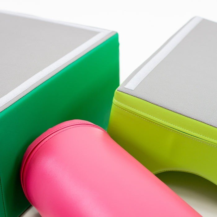 6. Detail of pink cylindrical and green rectangular foam blocks with gray tops from IGLU Explorer set