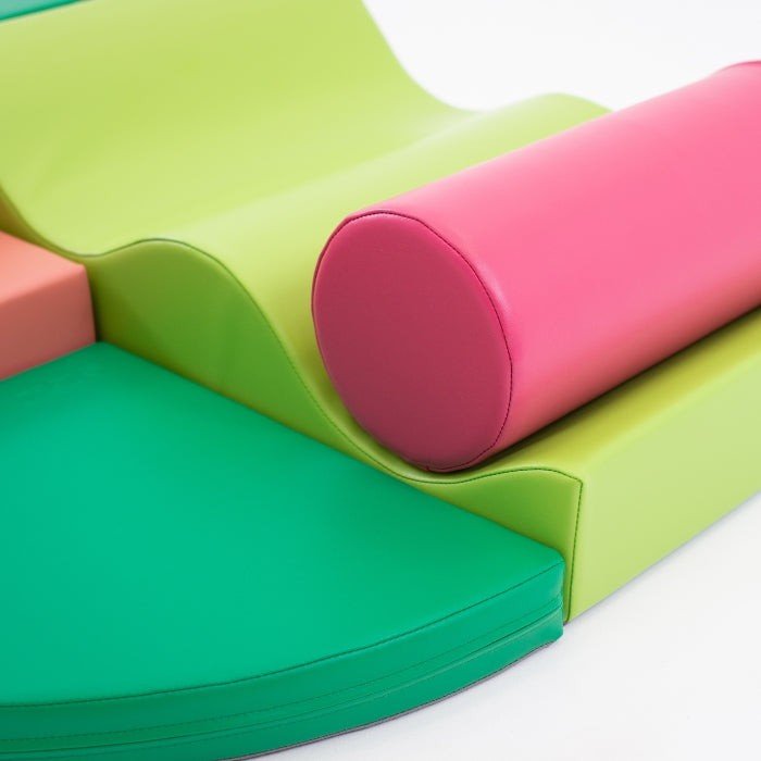 7. Close-up of pink cylindrical and green curved foam blocks from IGLU Explorer set