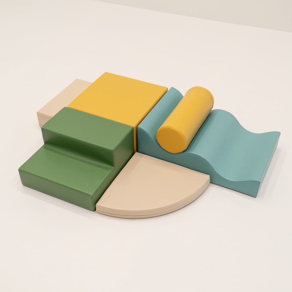 9. IGLU Explorer Set with pastel turquoise, yellow, and green foam blocks arranged in a semi-circle