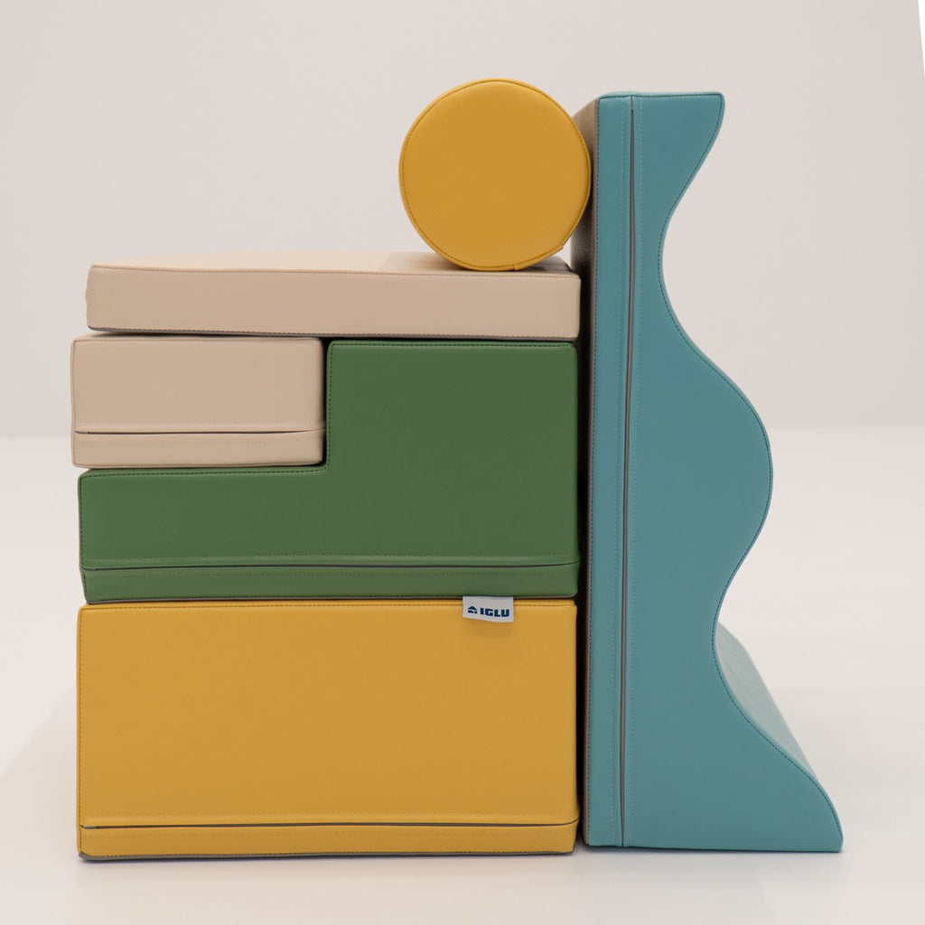 23. Side view of stacked IGLU Explorer Set with pastel turquoise, yellow, and green foam blocks