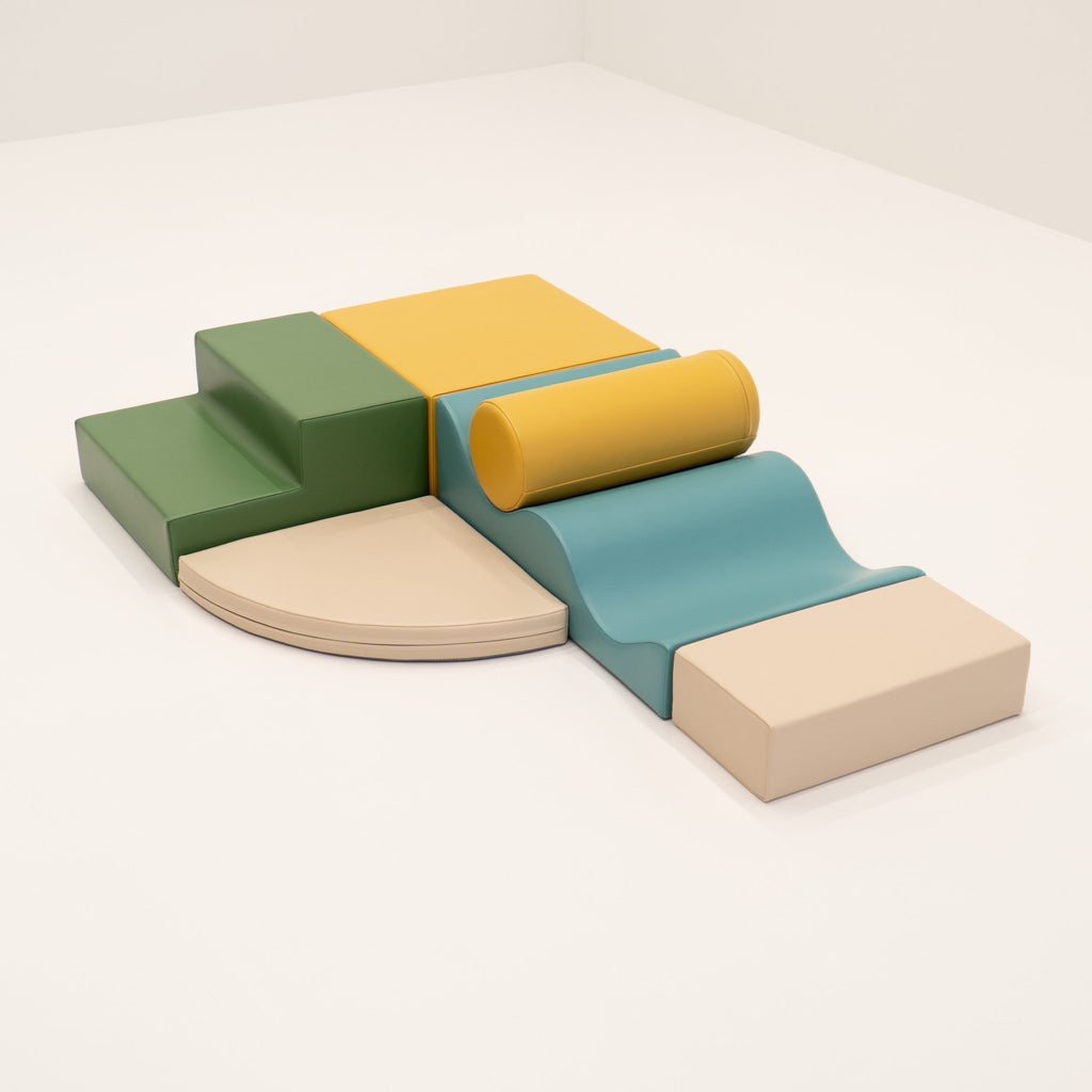 14. IGLU Explorer Set with pastel turquoise, yellow, and green foam blocks arranged in a semi-circle